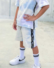 Boys streetwear shorts in pastel tie dye with raw cut hem